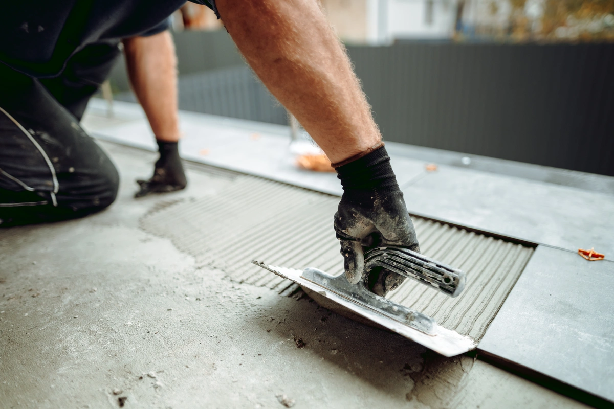 how to tile a bathroom floor putting in tiles