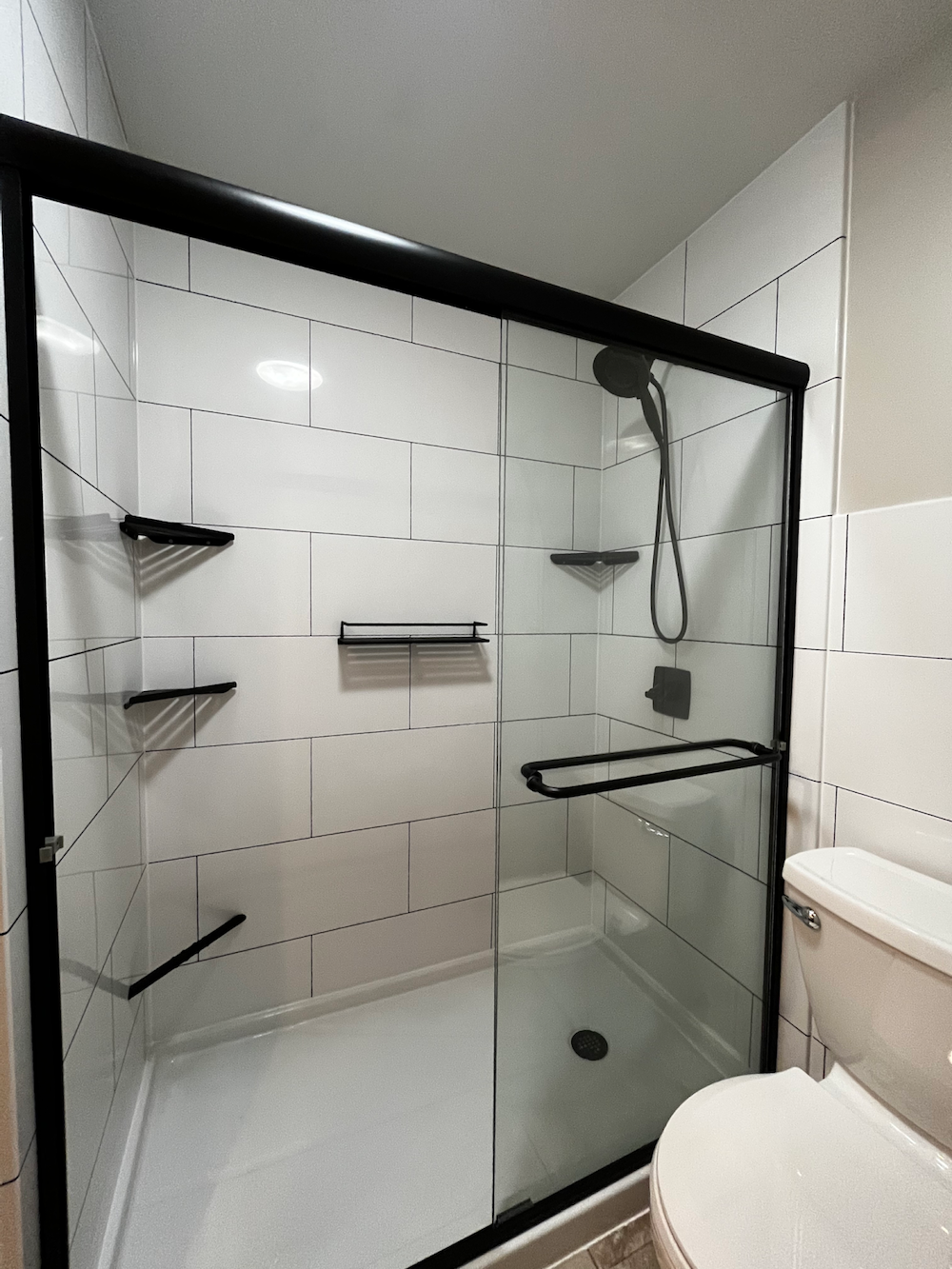 walk-in shower ideas black accents