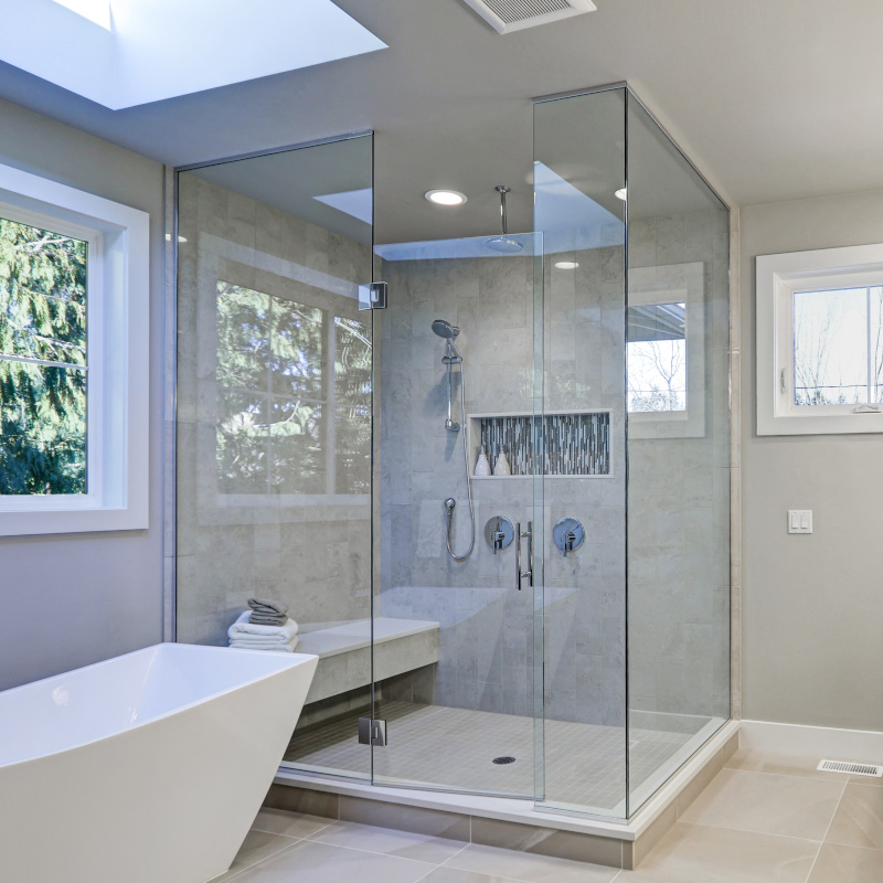 walk-in shower with glass shower enclosure