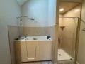 Comfortable walk-in bathtub providing safety and ease for daily use.