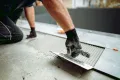 how to tile a bathroom floor putting in tiles