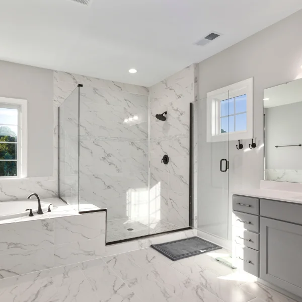 Modern walk-in shower remodel in Granger IN by Lori K Bath featuring Santorini wall surround and matte black fixtures