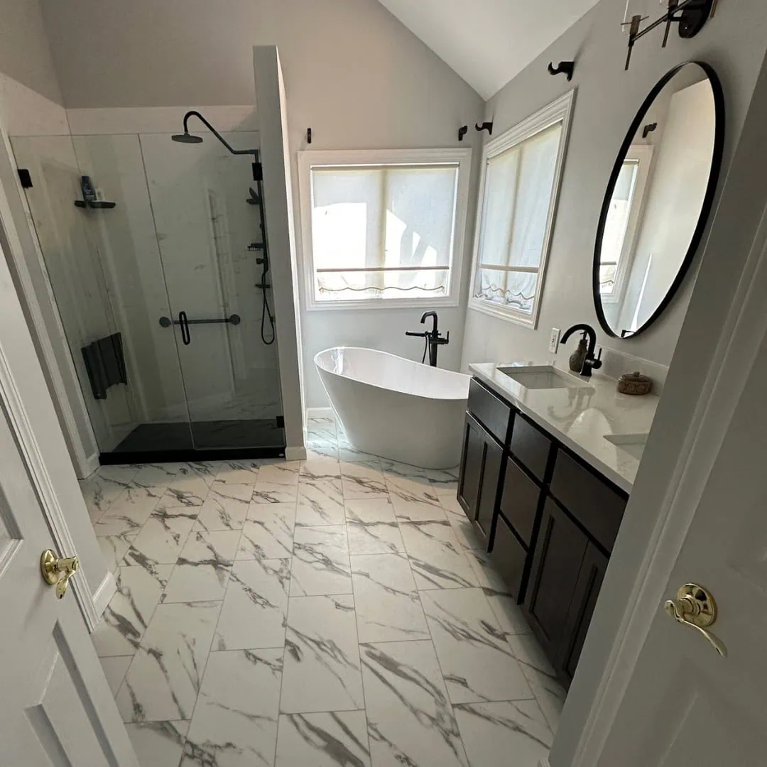 Modern tub-to-shower conversion showcasing a spacious and clean bathroom design in Chesterton, Indiana.