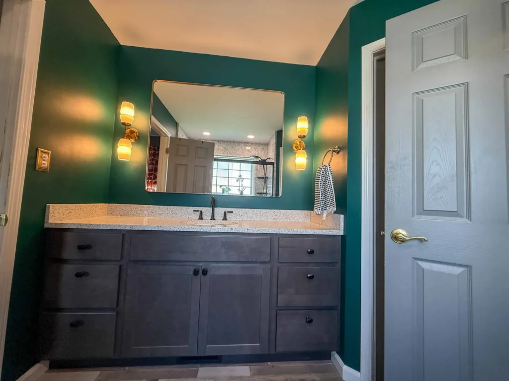 Stylish bathroom renovation showcasing a sleek freestanding tub and ample storage solutions.