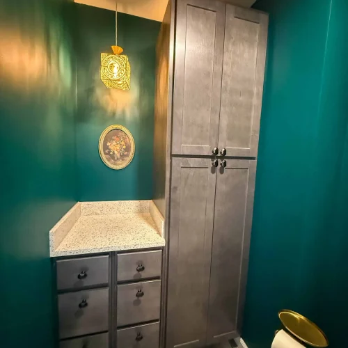 Contemporary bathroom design featuring a freestanding tub and organized storage.