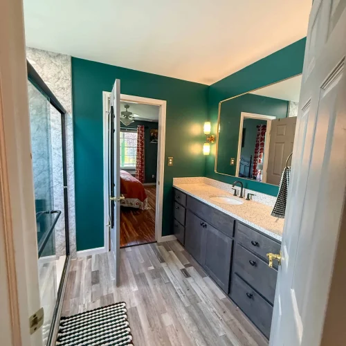 Stylish bathroom renovation with enhanced storage and updated fixtures for functionality.