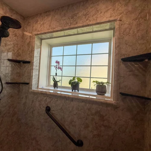 Modern bathroom remodel featuring a spacious shower and freestanding tub for relaxation.