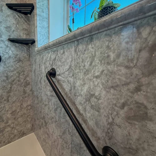 Updated bathroom with improved storage and a relaxing freestanding tub for comfort.