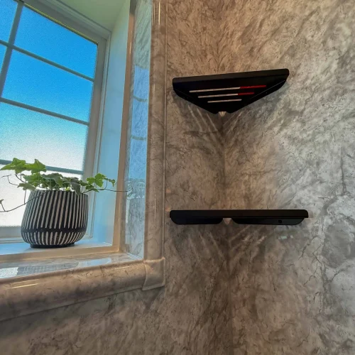 Elegant bathroom renovation with a sleek shower design and contemporary fixtures.