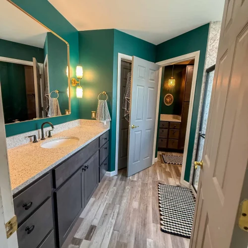 Elegant bathroom transformation featuring a spacious shower and modern amenities.