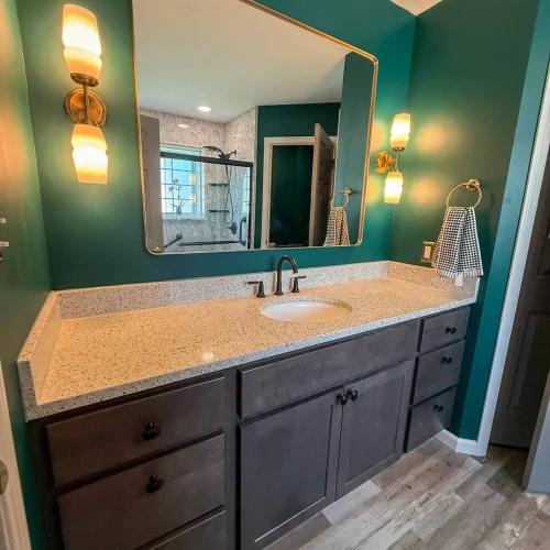 Renovated bathroom showcasing a sleek design and improved storage options.