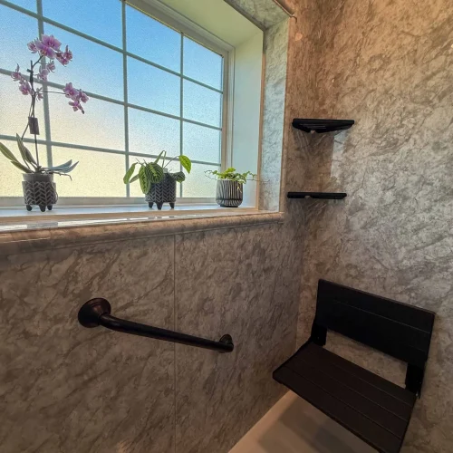 Modern bathroom remodel featuring a spacious freestanding tub and elegant storage solutions.