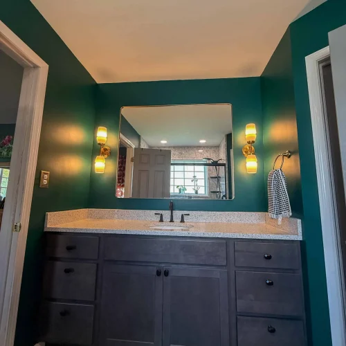 Stylish bathroom remodel with updated fixtures and ample storage solutions.
