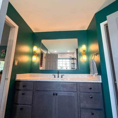 Modern bathroom featuring a freestanding tub and spacious shower area for relaxation.