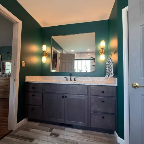 Renovated bathroom with a modern shower design and stylish freestanding tub for relaxation.