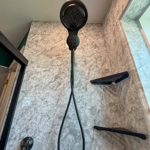 Stylish bathroom renovation showcasing a spacious shower and modern fixtures.