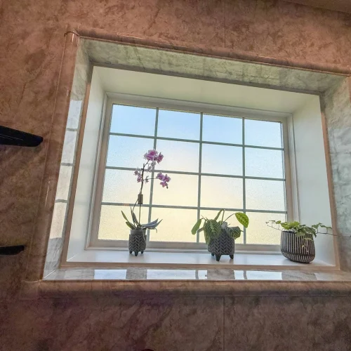Contemporary bathroom remodel featuring a spacious layout and stylish storage options.