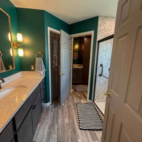 Bright and functional bathroom remodel with improved storage solutions.