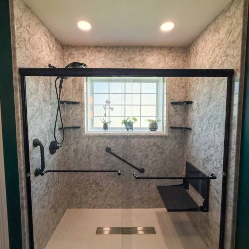 Modern bathroom remodel featuring a freestanding tub and spacious shower area.