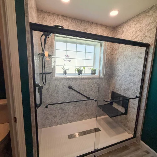 Contemporary bathroom remodel with a freestanding tub and organized storage solutions.