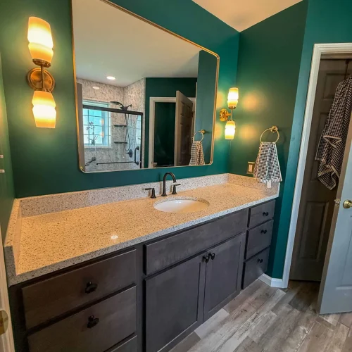 Stylish bathroom renovation showcasing a sleek shower area and contemporary design elements.