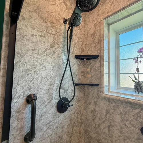 Stylish bathroom renovation showcasing updated storage solutions and a sleek design.